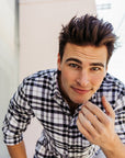 Man looking at hair